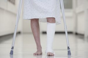 person in the hospital with a broken leg. you may be wondering what to get someone with a broken leg. read our guide