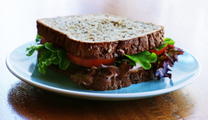 sandwich on a plate. a good, hearty sandwich is one of the best meal train ideas for new mom