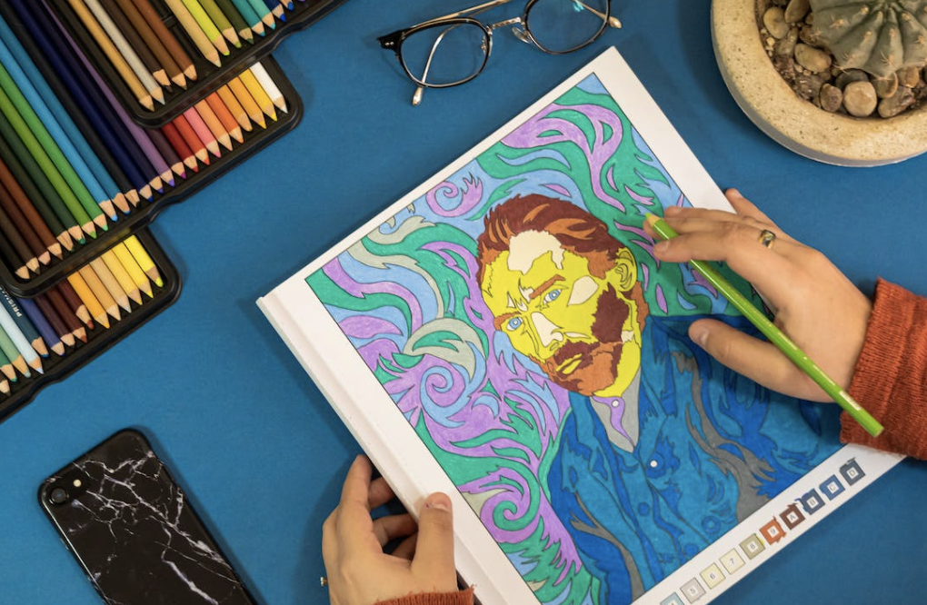 person with cancer coloring a picture of van gogh with colored pencils