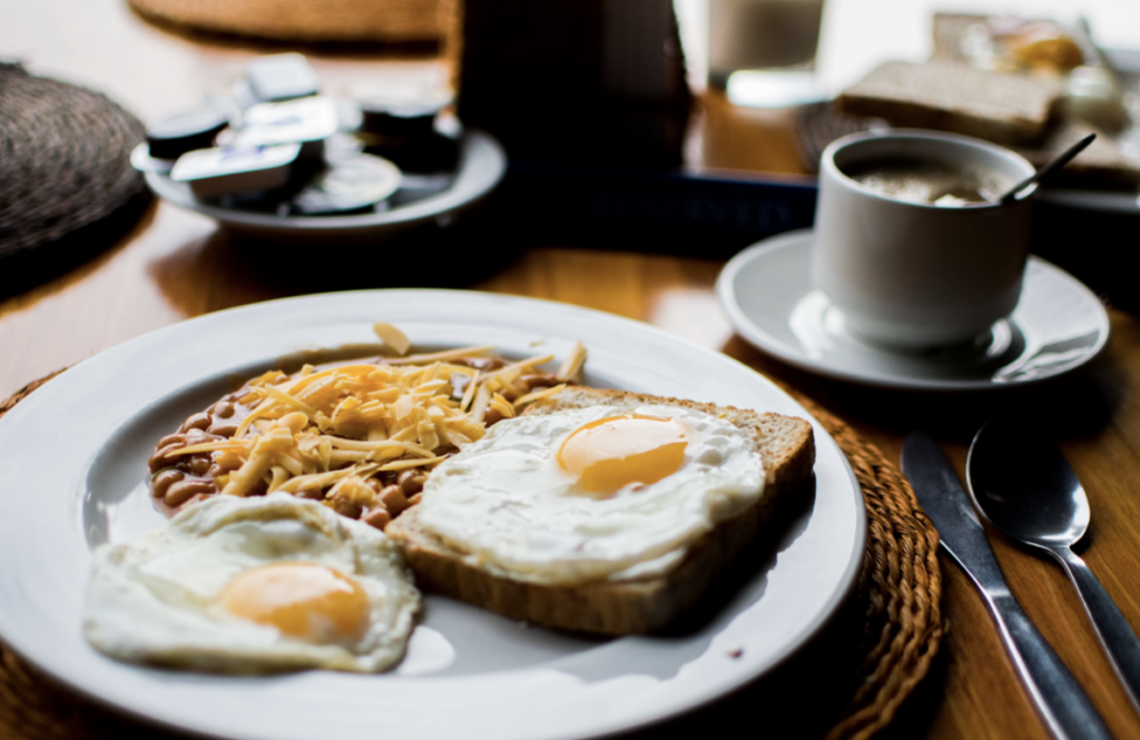 eggs on toast with beans and coffee
