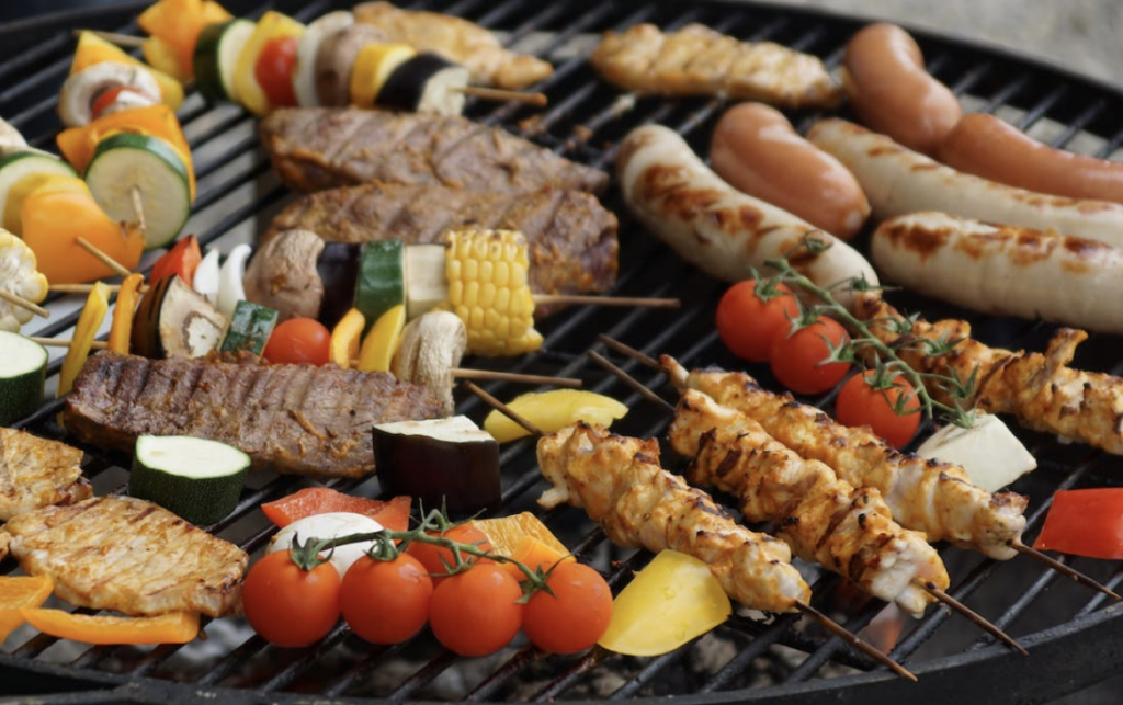 vegetable and meat kebabs on a grill, barbecue cookouts are a great idea for a meal train for churches