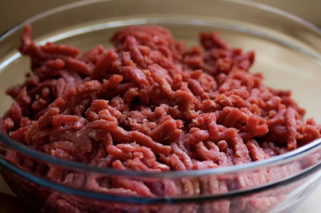 ground beef in a bowl, one of the Best Ways to Make Meatloaf for a Meal Train