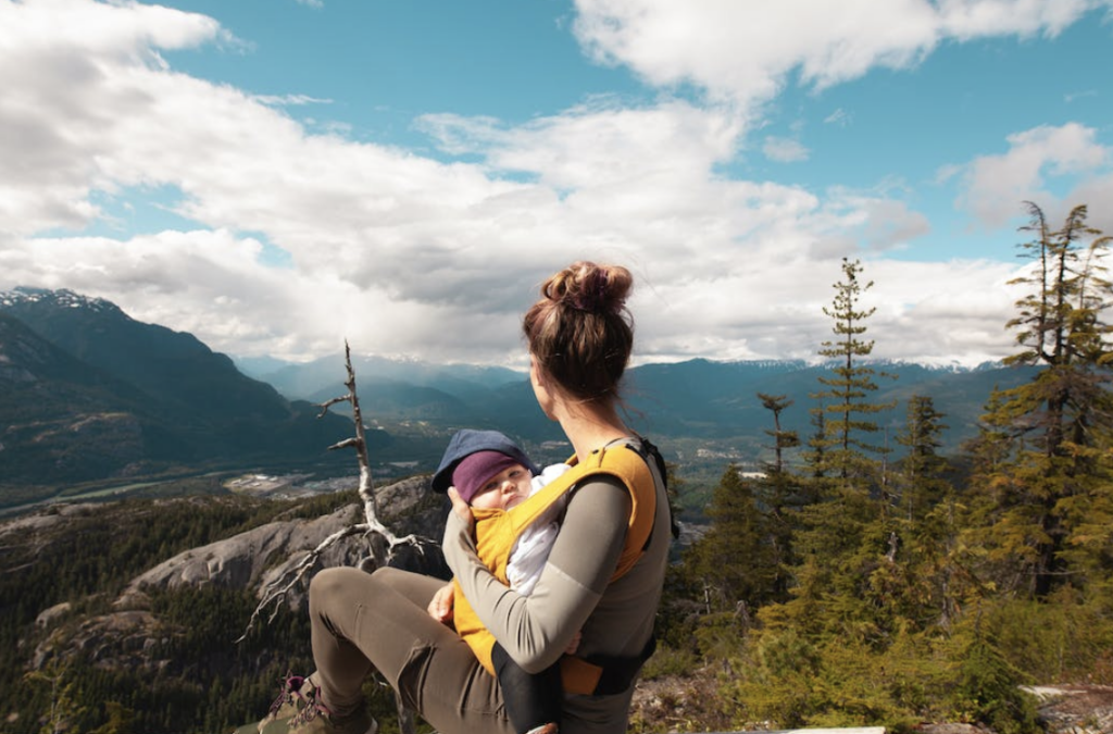 mom with baby strapped to her chest on a hike