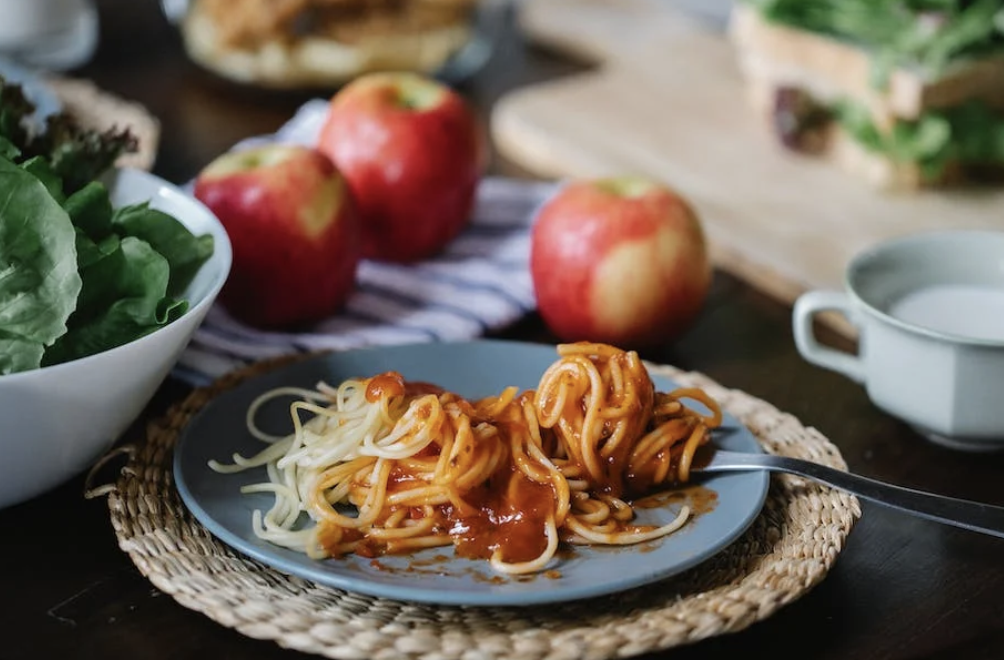 pasta meal on a plate, meals and snacks are vital parts of the best care package for new parents