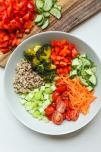 A bowl of grains and vegetables. Fresh salads make for great meal train ideas.