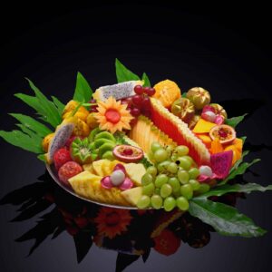 assorted fruits decoratively cut and arranged on a platter, great summer meal train ideas